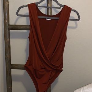Free people- small/medium burgundy body suit